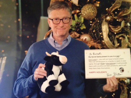 Bill Gates holds a sign and gift that he gave in the Reddit anonymous secret Santa program.