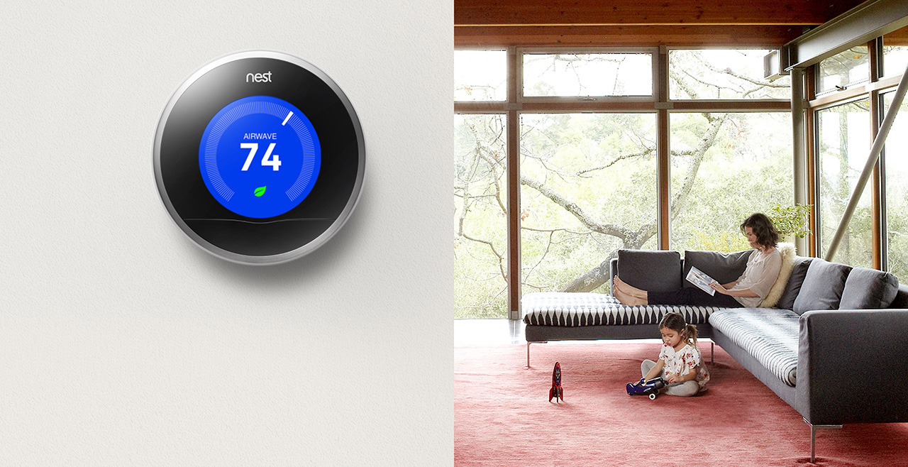 PHotograph of the Nest Thermostat installed in a home.